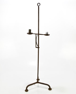 Lot 1621 - A cast iron free standing candle holder,...