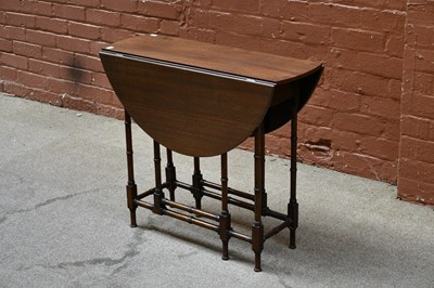 Lot 2653 - A 1950's mahogany drop leaf table on bamboo...