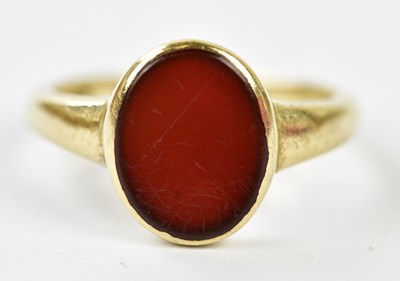 Lot 243 - A 9ct yellow gold and carnelian ring, size M,...