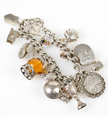 Lot 759 - A sterling silver charm bracelet set with...