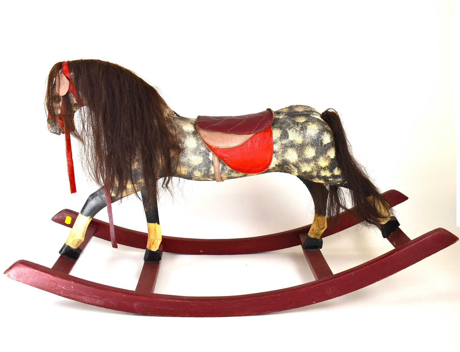 Lot 213 - A vintage rocking horse, height 62cm, length...