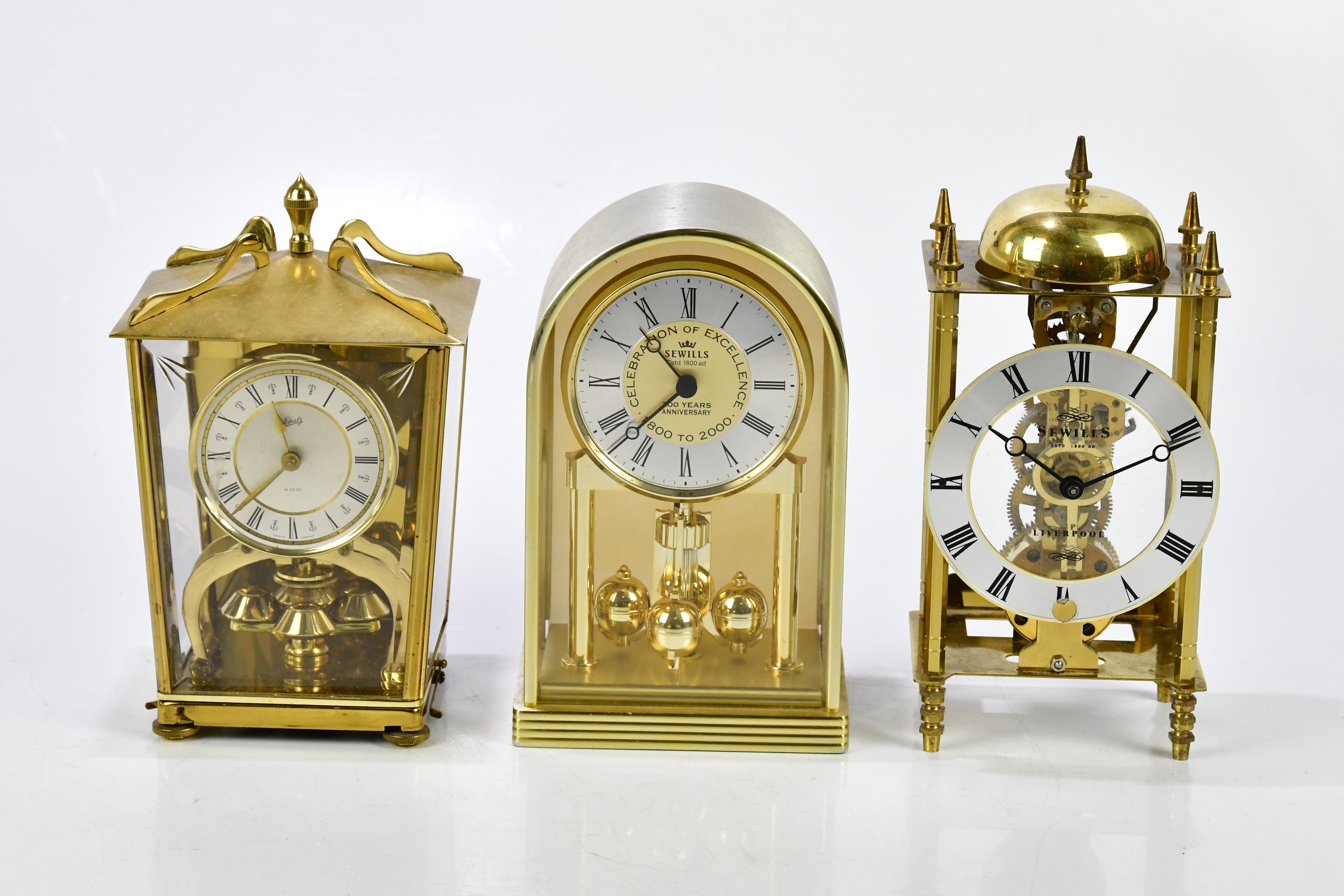 Lot 2306 A group of five modern brass mantel clocks,