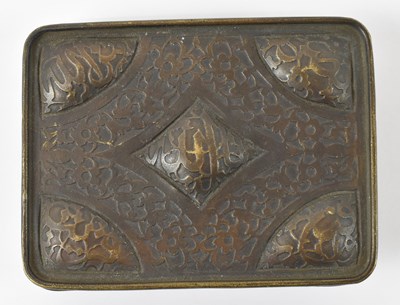 Lot 384 - An Islamic bronze belt buckle, 8.5 x 6cm.