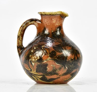 Lot 170 - MARTIN BROTHERS; a miniature jug of bulbous...