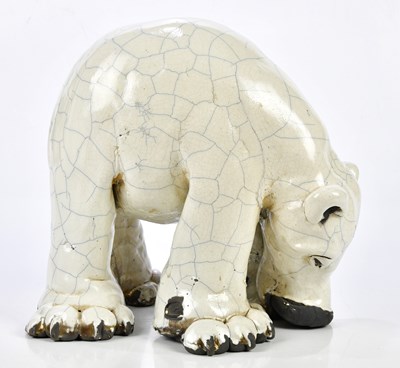 Lot 172 - A raku model of a polar bear with crackle...