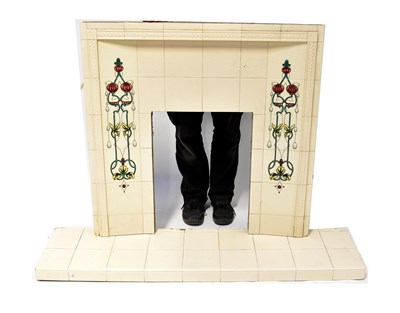 Lot 86 - An early 20th century tiled fireplace with Art...