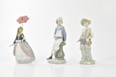 Lot 2182 - LLADRO; six figures to include young boy...