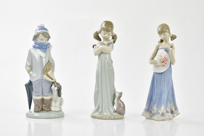 Lot 2182 - LLADRO; six figures to include young boy...