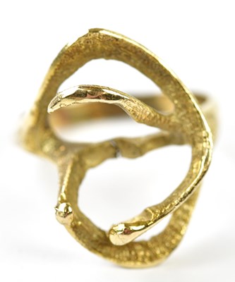 Lot 279 - A yellow metal textured dress ring, stamped...