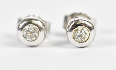 Lot 641 - A pair of 18ct white gold and diamond collet...