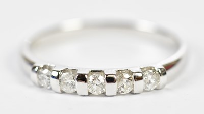 Lot 173 - A 9ct white gold five stone diamond ring, the...