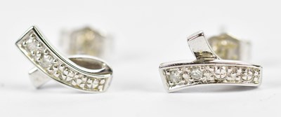 Lot 649 - A pair of 9ct white gold and diamond swept...