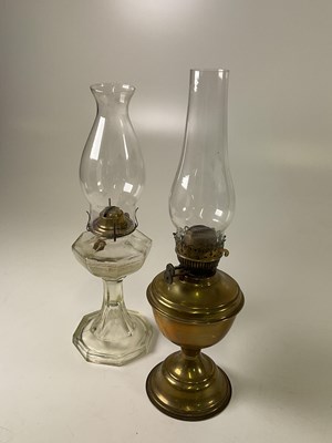 Lot 539 - A brass oil lamp, height 51cm, and a glass lamp