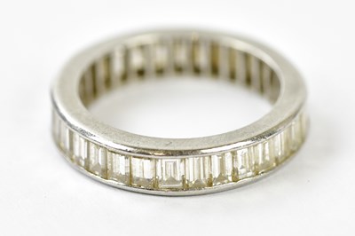 Lot 61 - A white metal and diamond full eternity ring...
