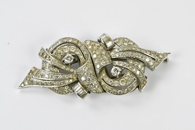 Lot 562 - A 1950s white metal diamond set combination...