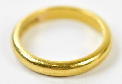 Lot 152 - A 22ct yellow gold wedding band, size P,...