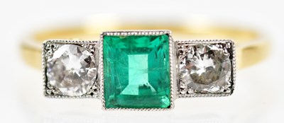 Lot 51 - An 18ct yellow gold white metal tipped emerald...
