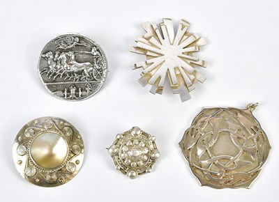 Lot 577 - A group of four silver/white metal brooches...