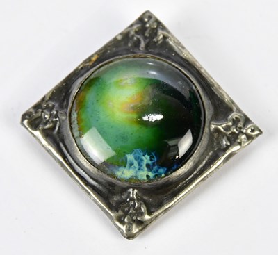 Lot 799 - A Ruskin type brooch centred with a glazed...