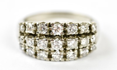 Lot 52 - A white metal diamond three row cluster ring...