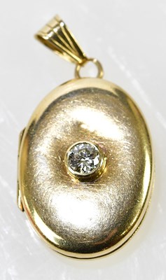 Lot 350 - A 9ct yellow gold and diamond oval locket set...