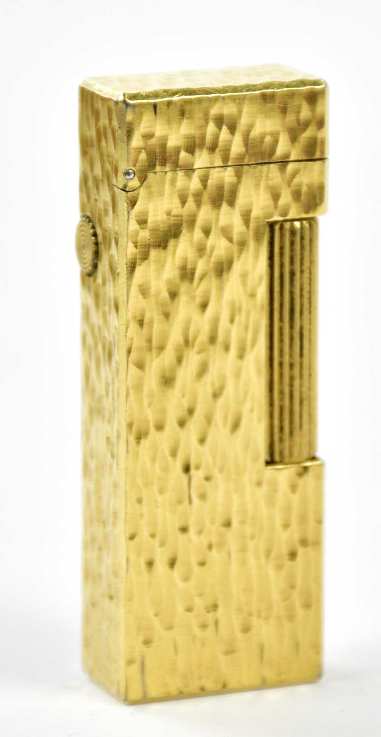 Lot 17 - DUNHILL; a gold plated textured rectangular...