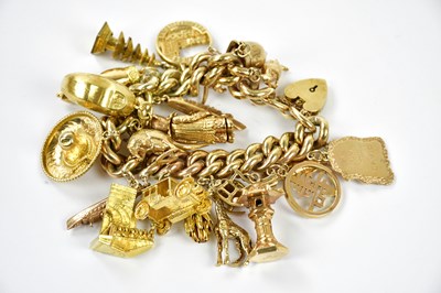 Lot 491 - A substantial 9ct gold charm bracelet set with...