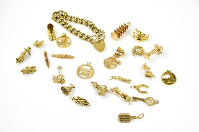 Lot 493 - A 9ct yellow gold charm bracelet set with...