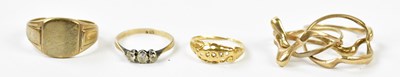 Lot 187 - A 9ct yellow gold puzzle ring, a 9ct yellow...