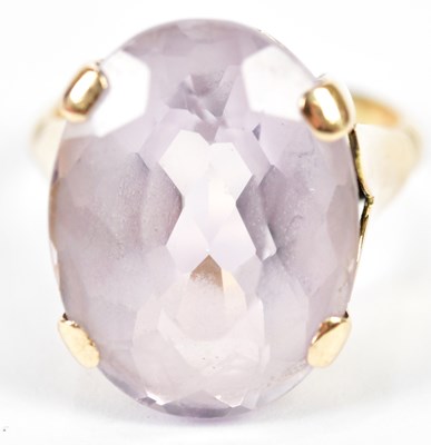 Lot 185 - A yellow metal and pale amethyst dress ring...