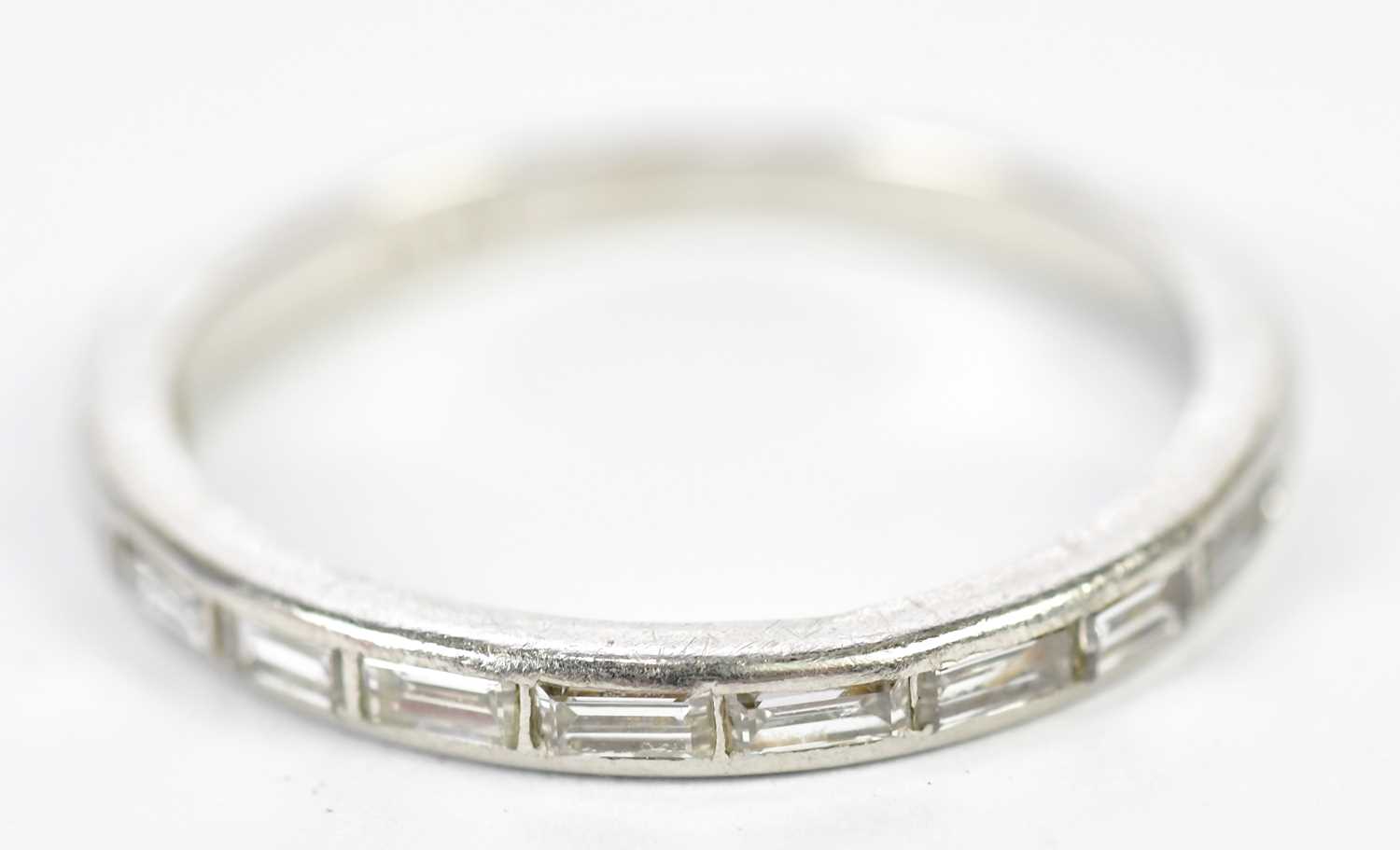 Lot 151 - A platinum and diamond eleven stone baguette...