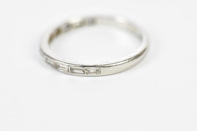 Lot 151 - A platinum and diamond eleven stone baguette...