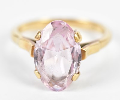 Lot 226 - A 9ct yellow gold and pale amethyst dress ring,...