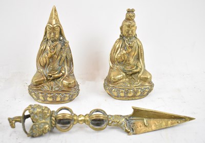 Lot 614 - A pair of 19th century Nepalese polished brass...