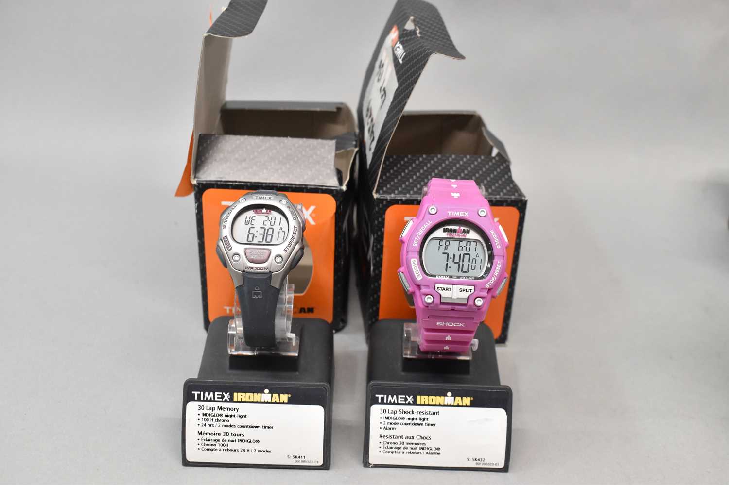 Lot 705 - TIMEX; two 'Iron Man' wristwatches in original...