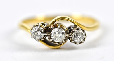 Lot 110 - An 18ct yellow gold and platinum three stone...