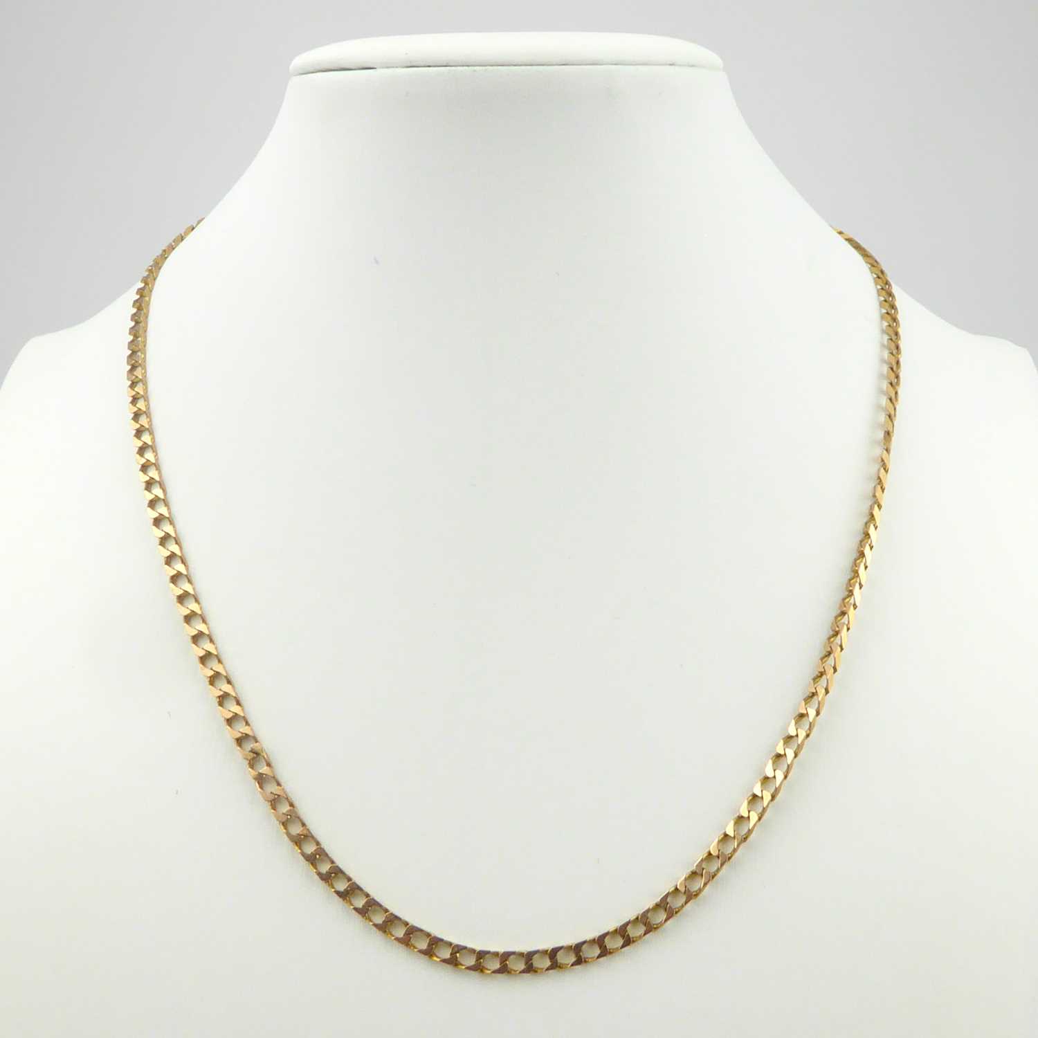 Lot 946 A 9ct gold flat curb necklace with lobster