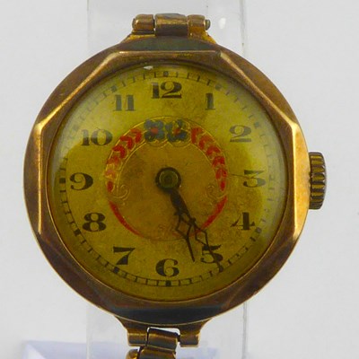 Lot 1073 - A ladies' 9ct gold wristwatch, the silvered...