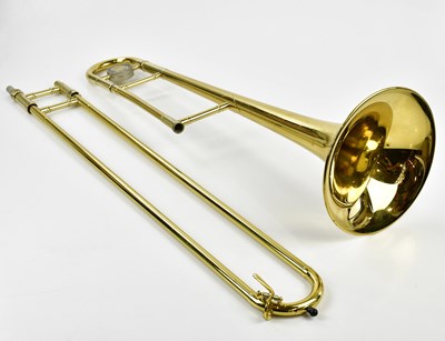 Lot 1319 - KING; a brass cased trombone, S.N: 923630, 117cm.