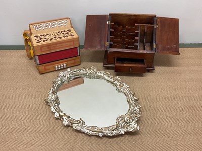 Lot 29 - A wooden desk tidy, decorative mirror, and an...