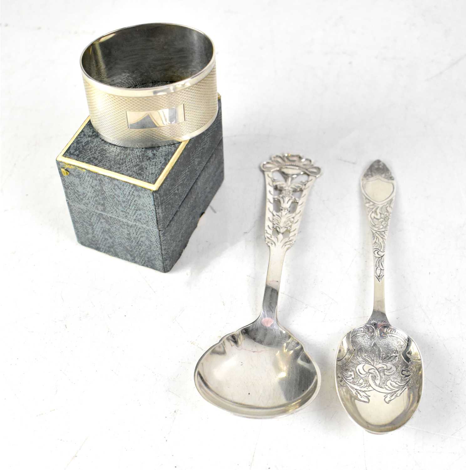 Lot 444 - A hallmarked silver spoon with chased decoration