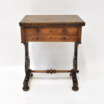Lot 59 - A Victorian walnut work table with swivel...