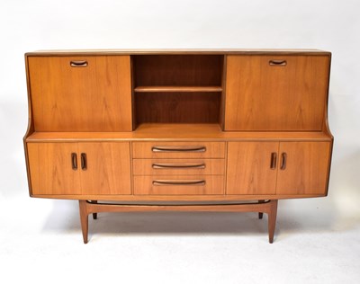 Lot 15 - G-PLAN; a high top teak sideboard with sliding...