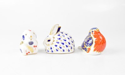 Lot 253 - ROYAL CROWN DERBY; three Imari paperweights,...