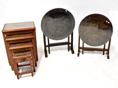 Lot 39 - A Chinese carved hardwood circular tilt-top table