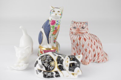 Lot 401 - Four porcelain cat figures comprising a Royal...