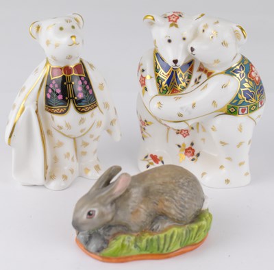 Lot 394 - ROYAL CROWN DERBY; two bear porcelain figures...