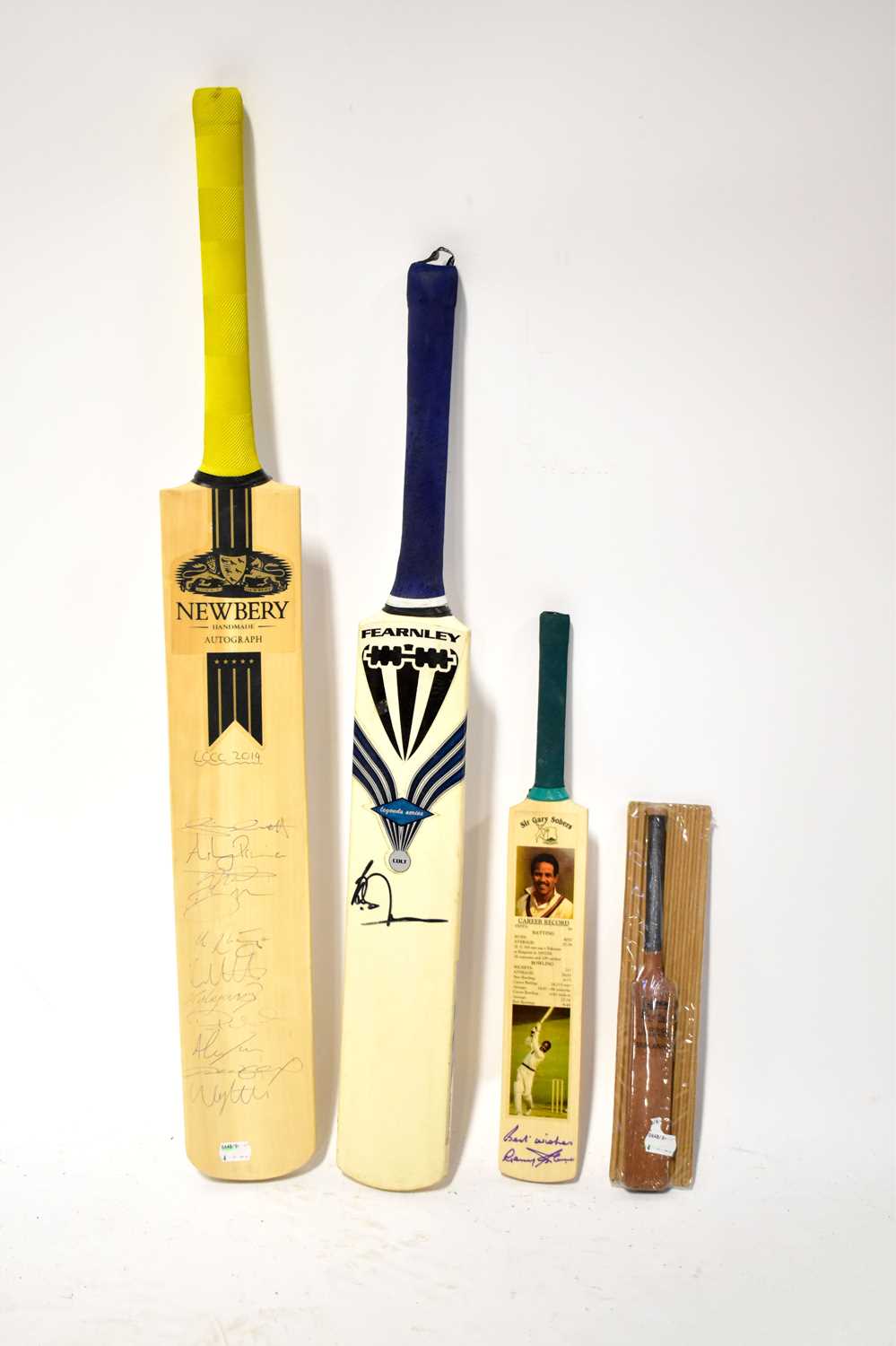 Lot 382 - Four signed cricket bats