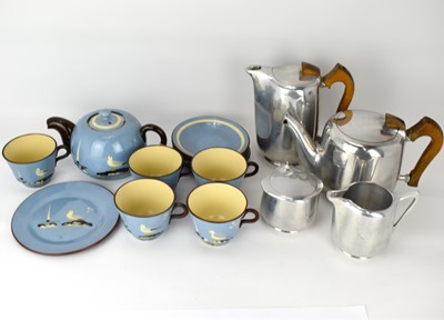 Lot 142 - PICQUOT WARE; a four-piece tea set comprising...