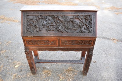 Lot 1068 - A 20th century Chinese carved camphor wood...